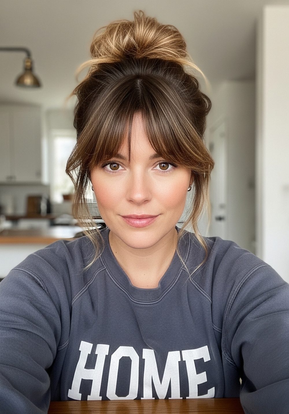 Messy Bun with Loose Curtain Bangs
