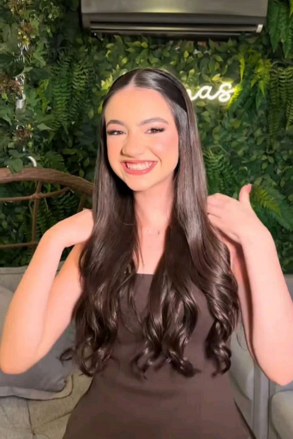 Sleek Center-Part Half-Up Style with Long Soft Curls